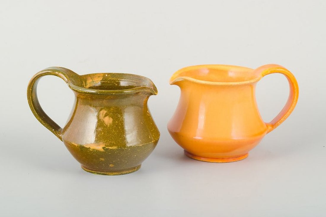 Kahler, Denmark. Two ceramic pitchers with uranium glaze. Circa 1930s. (1 of 5)