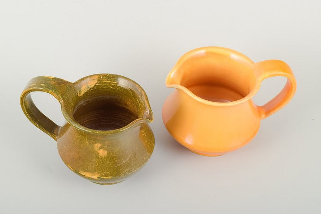 Kahler, Denmark. Two ceramic pitchers with uranium glaze. Circa 1930s. - 2