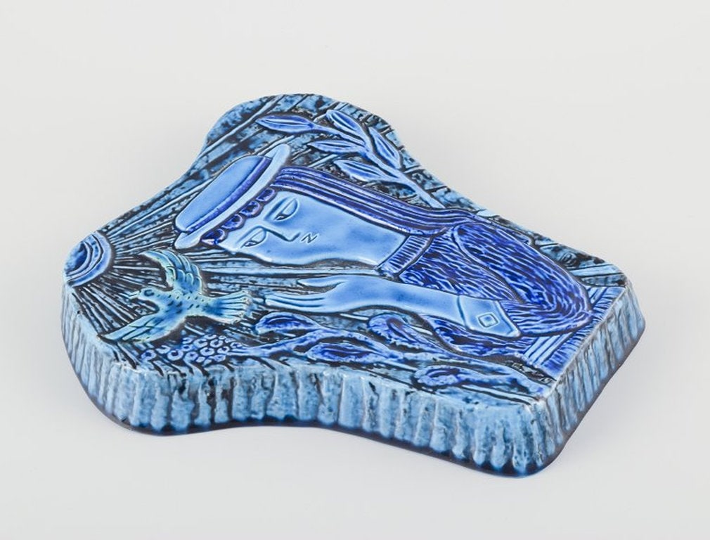Gunnar Nylund for Rorstrand, Sweden. Large wall relief in glazed ceramic. Mid-20th century.: Gunnar Nylund for Rorstrand, Sweden. Large wall relief in glazed ceramic. Glaze in shades of blue. Motif of woman and bird. Organic form. Wall hanging. Marked. Mid-20th century. First factory quality.