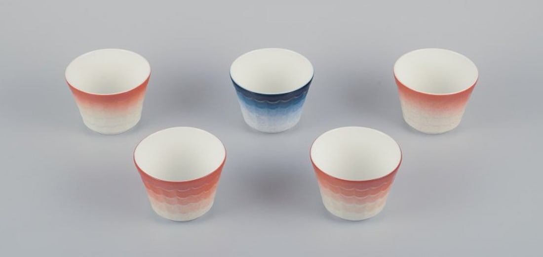Wilhelm Kage for Gustavsberg, Sweden. Five porcelain plant pots. Glazed in orange and blue. 1960s. (1 of 9)