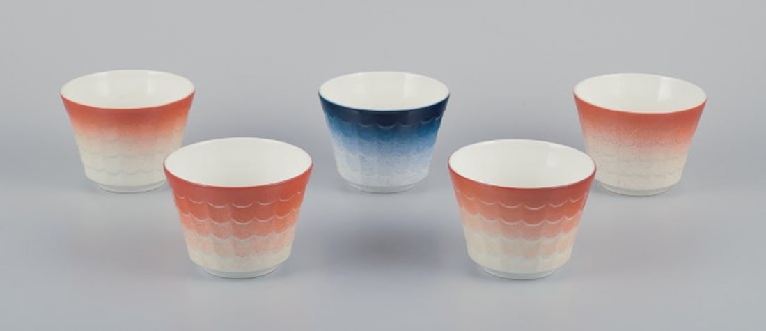 Wilhelm Kage for Gustavsberg, Sweden. Five porcelain plant pots. Glazed in orange and blue. 1960s. - 2