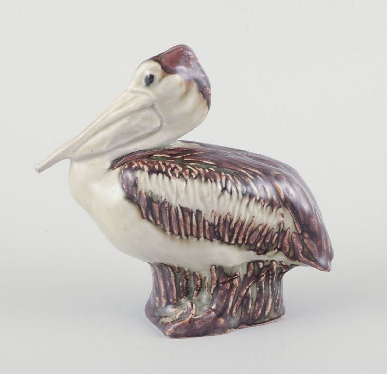 Jeanne Grut for Royal Copenhagen. Ceramic pelican figurine. Mid-20th century. - 2