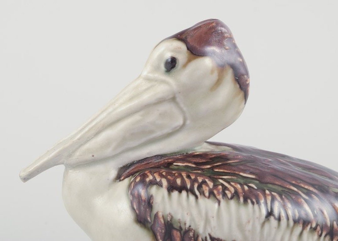 Jeanne Grut for Royal Copenhagen. Ceramic pelican figurine. Mid-20th century. - 3