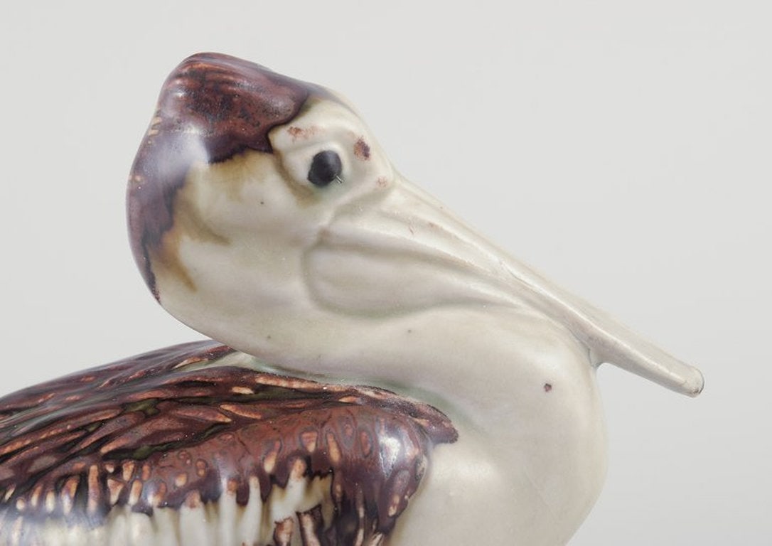 Jeanne Grut for Royal Copenhagen. Ceramic pelican figurine. Mid-20th century. - 4