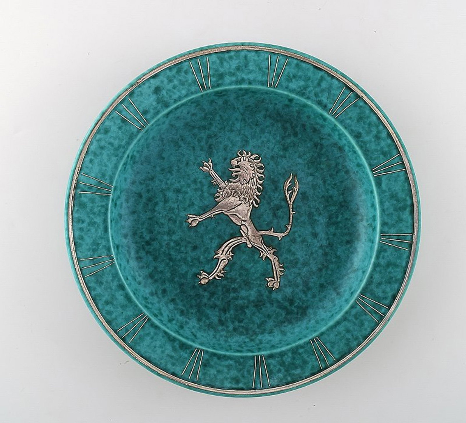Wilhelm Kage, Gustavsberg, art deco Argenta dish on feet in ceramics decorated with lion in silver: Wilhelm Kage, Gustavsberg, art deco Argenta dish on feet in ceramics decorated with lion in silver inlaid. Model number: A24. Sweden 1940's. Measures 23 x 4 cm. Stamped Gustavsberg, Kage. in perfect c
