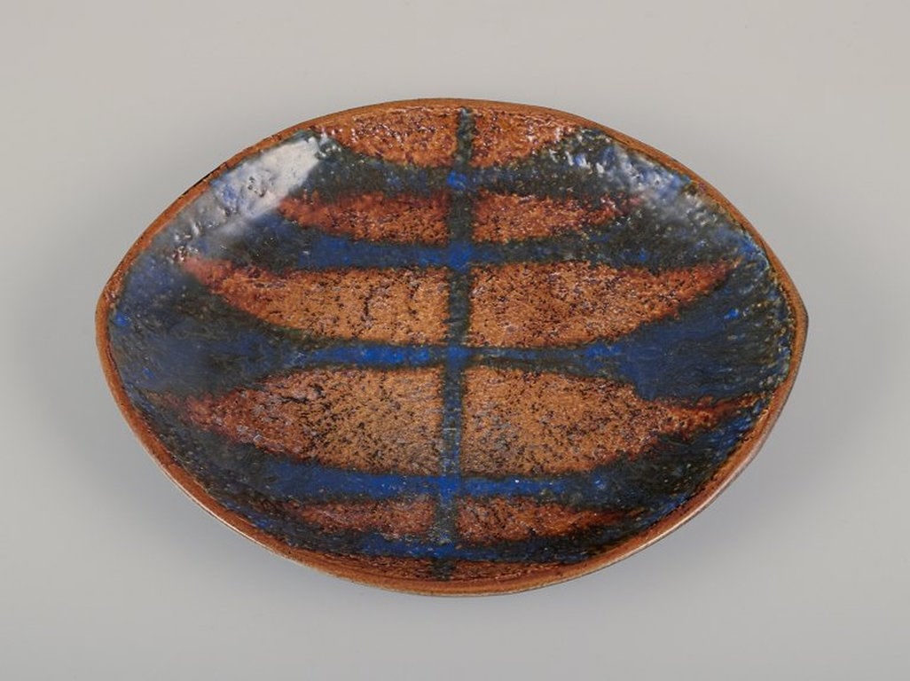 Mari Simmulson for Upsala Ekeby, Sweden. Low ceramic bowl with glaze in blue and ochre tones. (1 of 8)