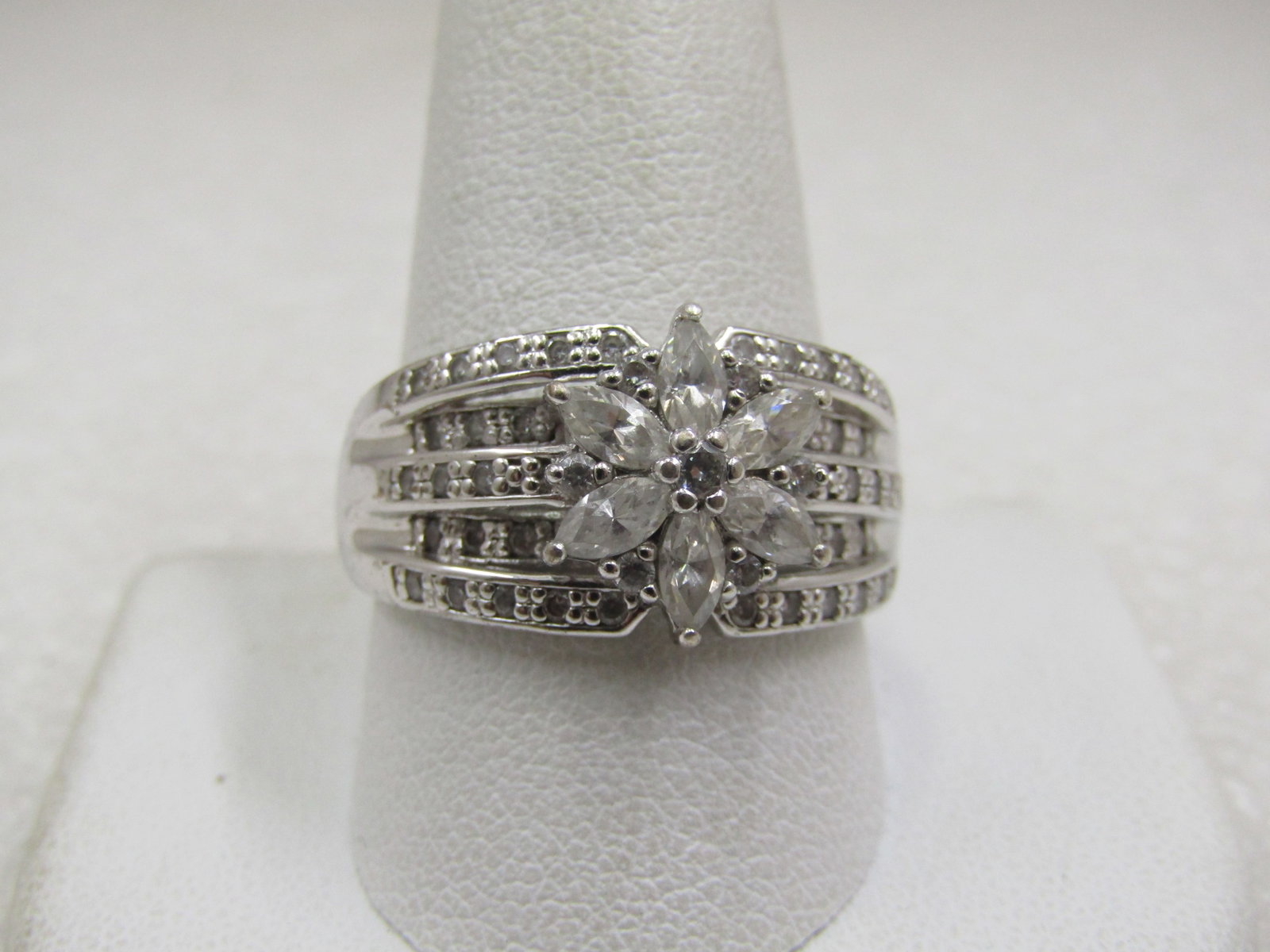 Vintage Sterling Wide Blossom CZ Ring, Sz. 11.5, Signed: Title: Vintage Sterling Wide Blossom CZ Ring, Sz. 11.5, Signed Description: Vintage Sterling Wide Blossom CZ Ring, Sz. 11.5, Signed SU .925 and CZ. There are five tiered bands over the top of the