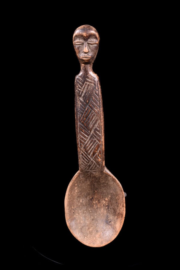 Tribal Spoon – Wood – Lega – DR Congo: Stylistic wooden tribal spoon from the Lega tribe of DR Congo. The social value of the object explains the remarkable artistic quality. The spoons are known by many names, which roughly translates to