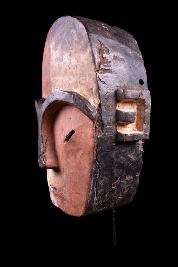 Mask – Wood – Jonga – DR Congo: The JONGA are a small, ethnic group in the center of the Congo. They live south of the MBOLE. So far only very few of their masks and sculptures are known. This mask made of light wood shows the typic