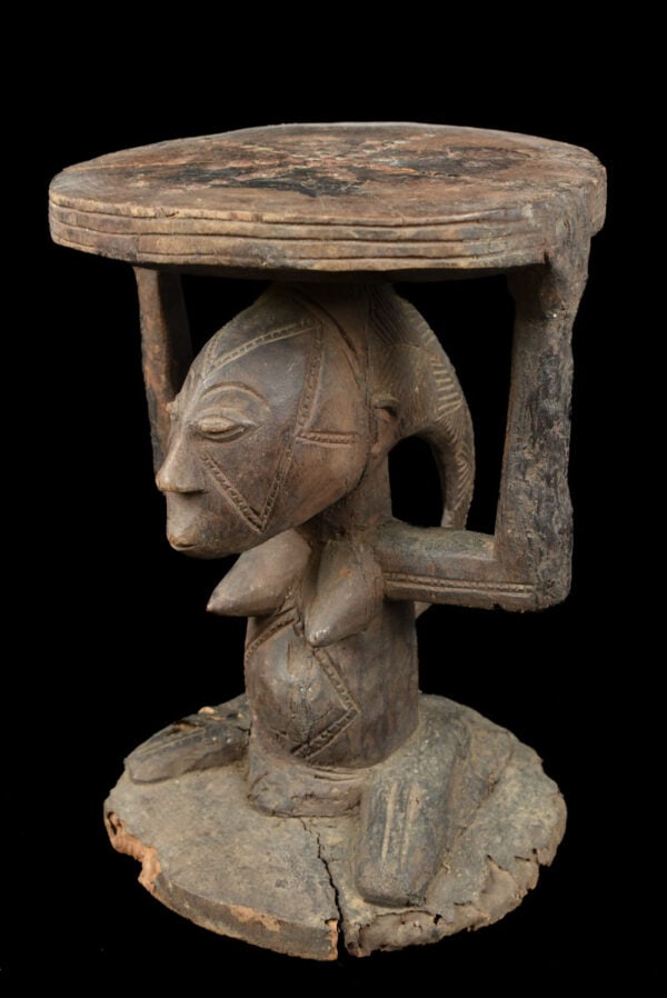 Stool - Wood - Luba - DR Congo: Powerfull Luba stool from DR Congo. Wondeful aged patina and great stylistic and detailed hairdo. In many cultures throughout the southeastern region of the Democratic Republic of Congo the seats of l