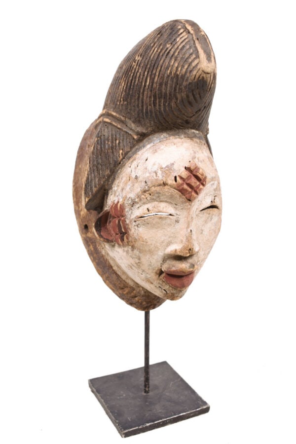 Initiation mask - Wood - Punu - Gabon: Wooden initiation mask from the PUNU tribe, Gabon. PUNU masks are thought to represent ancestors` faces. They are worn during funerals and by a Moukouji initiate who stands on stilts. This masks has a