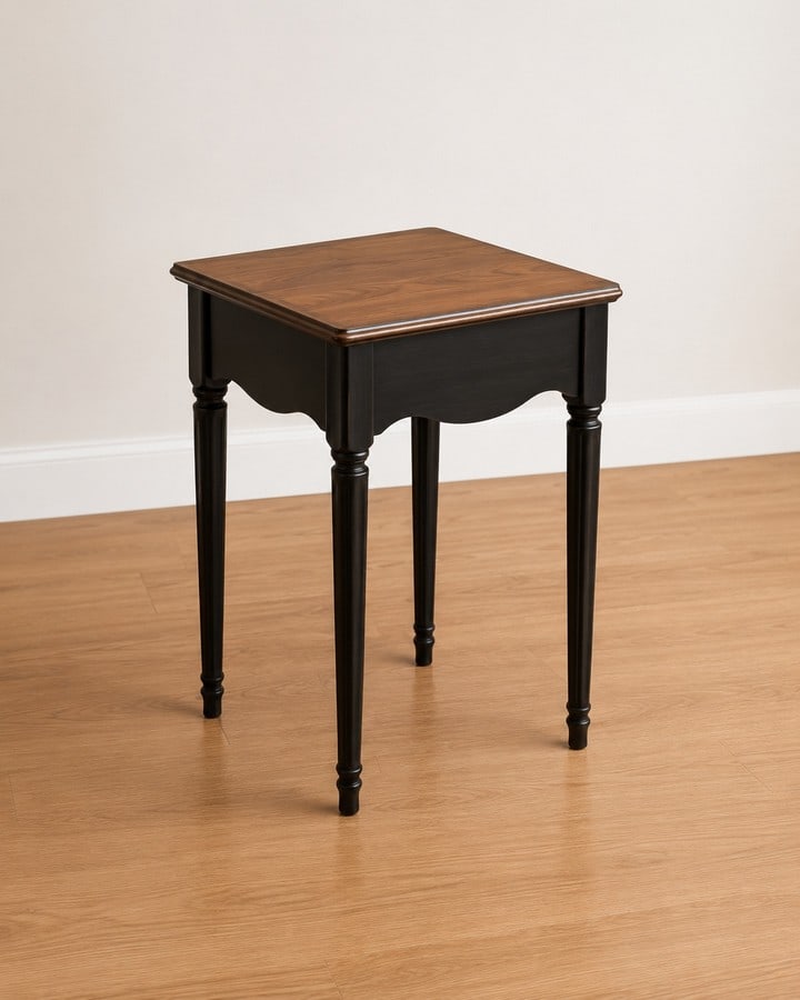 Petite French Provincial Style Black and Wood Accent Table: A charming petite accent table in French Provincial style, featuring a rectangular wooden top with a rich, natural finish. The apron and elegant cabriole legs are finished in a contrasting black,