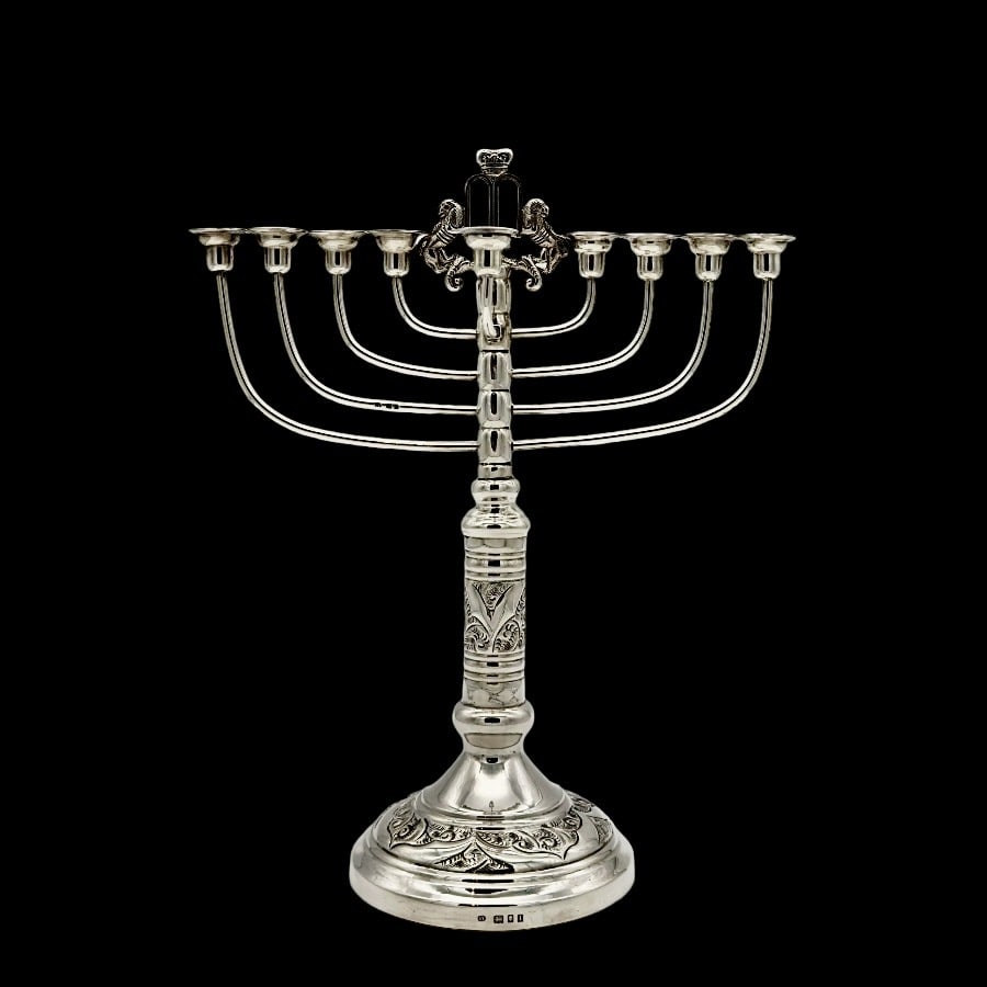 Early 20th Century Modern George V Silver Menorah London 1926 Aaron Taitelbaum: Description Stylish and incredibly unusual sterling silver Menorah decorated with elegant floral embossing and crowned with the blank Stone tablet that Moses brought down form mount Sinai. Weight: