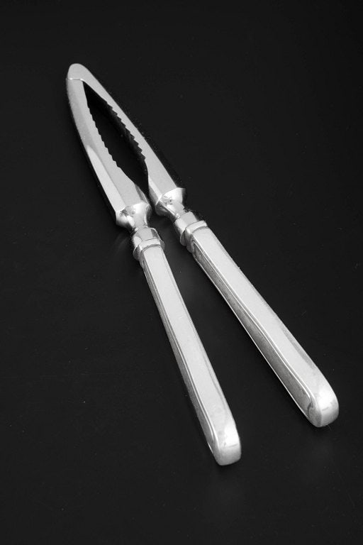Georg Jensen, Denmark. Nut cracker in stainless steel and sterling silver. Produced after 1944. (1 of 4)