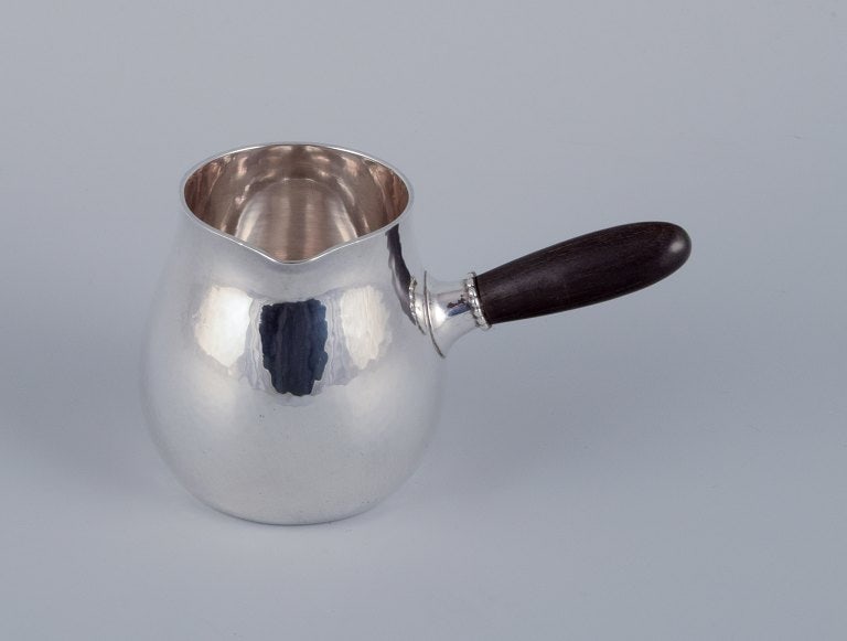 Georg Jensen creamer in sterling silver with an ebony handle.: Title:Georg Jensen creamer in sterling silver with an ebony handle. Description:Georg Jensen creamer in sterling silver with an ebony handle. Model 80A. In excellent condition with natural cracks in t