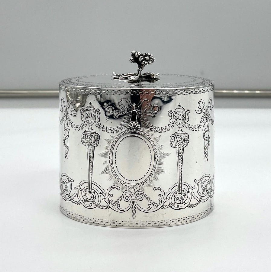 18th Century Antique George III Silver Tea Caddy London 1777 Thomas & Richard Payne: Description A beautiful Georgian silver flush hinged oval tea caddy decorated with fabulous contemporary bright cut hand engraving depicting wonderful floral designs and incredibly rare motifs of urns