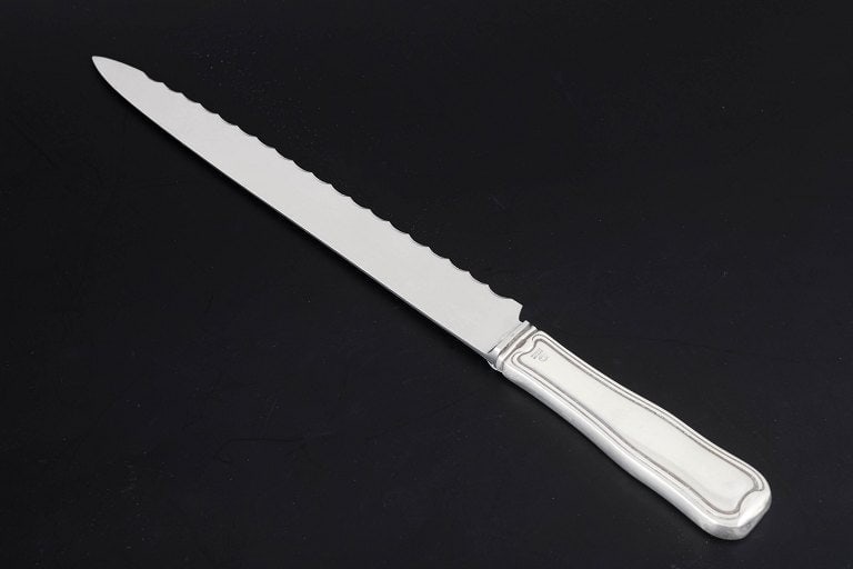 Georg Jensen, Denmark. Bread knife in stainless steel and sterling silver. Produced after 1944. (1 of 4)