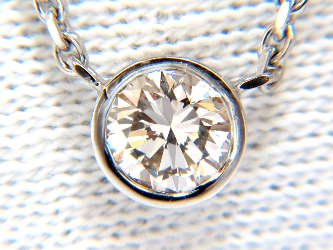 .54ct natural round brilliant diamond solitaire necklace i/vs2 16 inch 14k+: Title: .54ct natural round brilliant diamond solitaire necklace i/vs2 16 inch 14k+ Description: Classic Solitaire Flush set withing casing .54ct. round diamond Full cut brilliant Vs-2 Clarity. I- colo