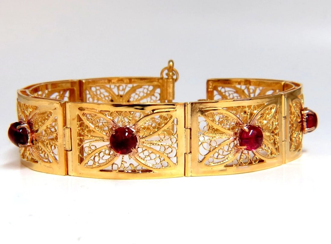 7.40ct Natural Spinel Open Gilt Vintage Bracelet 14 Karat gold: Title: 7.40ct Natural Spinel Open Gilt Vintage Bracelet 14 Karat gold Description: 7.40ct. Natural Cabochon Spinels bracelet. Vintage Open Gilt Design Vivid Red colors. Transparent & Clean Clarity. Av