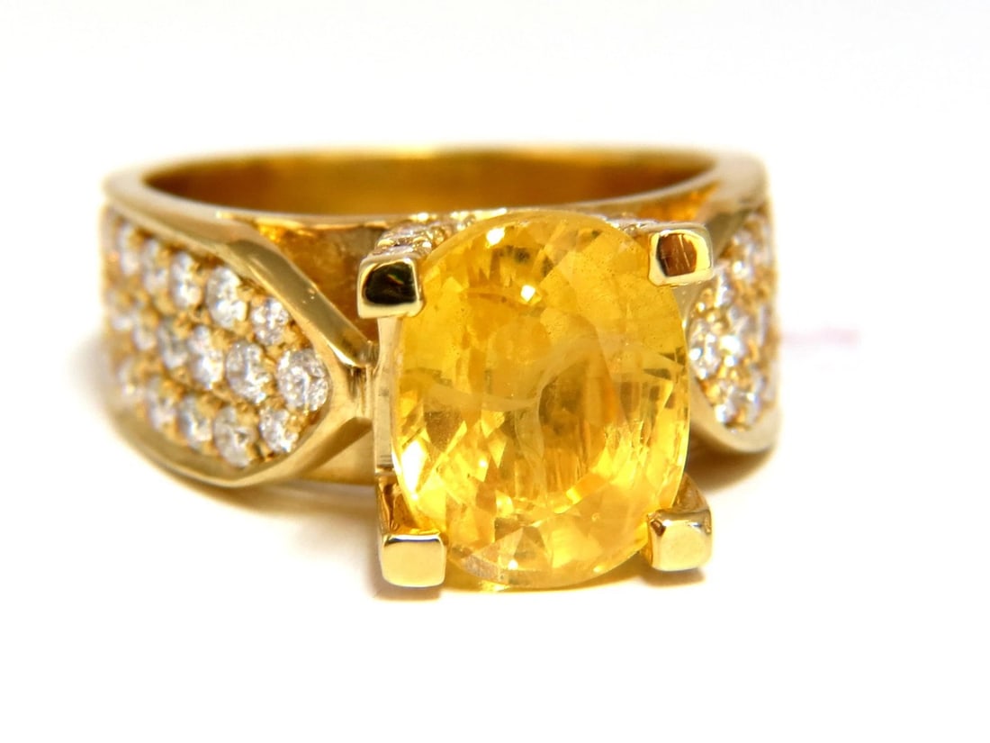 7.06ct Natural yellow sapphire ring 18kt. Raised Bead Set: Title: 7.06ct Natural yellow sapphire ring 18kt. Raised Bead Set Description: Natural Yellow Sapphire ring. 5.61ct. Natural yellow Sapphire 6.16 x 8.46mm Full cut oval brilliant Clean Clarity & Transp