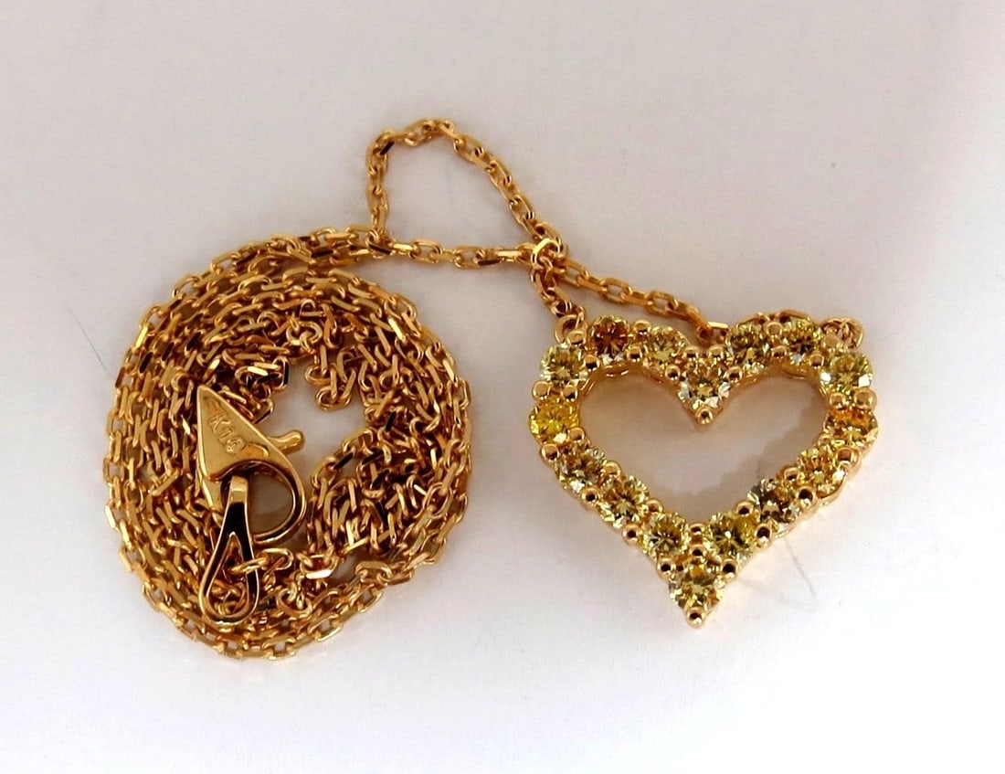 1.00ct Natural Fancy Yellow diamonds open heart necklace 14kt: Title: 1.00ct Natural Fancy Yellow diamonds open heart necklace 14kt Description: 1.00ct. Diamonds Open Heart Necklace. Natural Rounds, Full cuts. Fancy Yellow Colors Vs-2 clarity. Total Necklace
