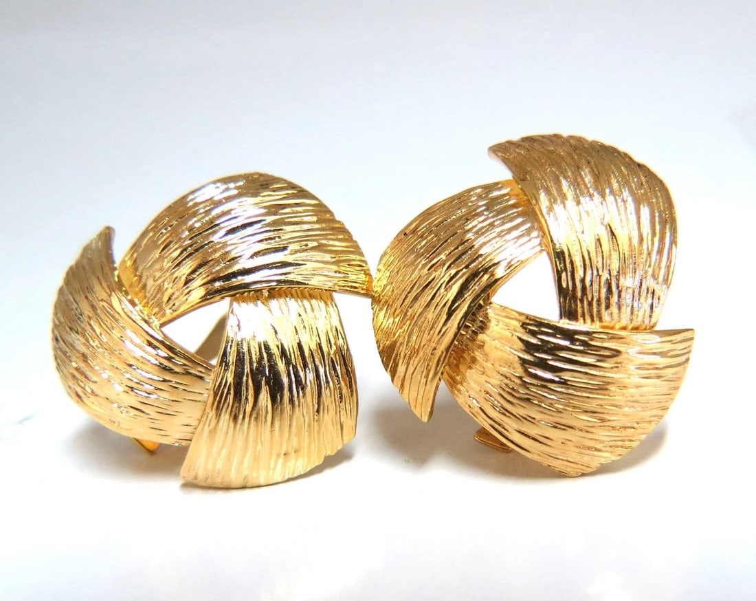 14kt. Three Dimensional Bark Finish Clip earrings: Title: 14kt. Three Dimensional Bark Finish Clip earrings Description: Three Dimensional Slight dome earrings Smooth Bark Finish Measurements of Earrings: 1.2 x 1.1 inch 16 grams / 14kt. yellow gold Co