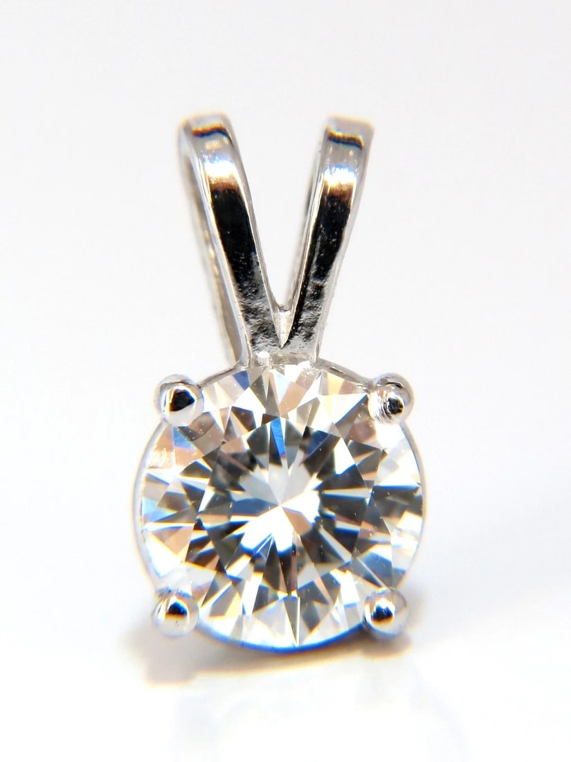 .70CT GIA E/VS1 SOLITAIRE DIAMOND PENDANT 14KT WHITE GOLD +: Title: .70CT GIA E/VS1 SOLITAIRE DIAMOND PENDANT 14KT WHITE GOLD + Description: GIA Certified: .70ct. Round diamond solitaire pendant. Full cut brilliant. Vs-1 Clarity. E-color. Report: 2155793922