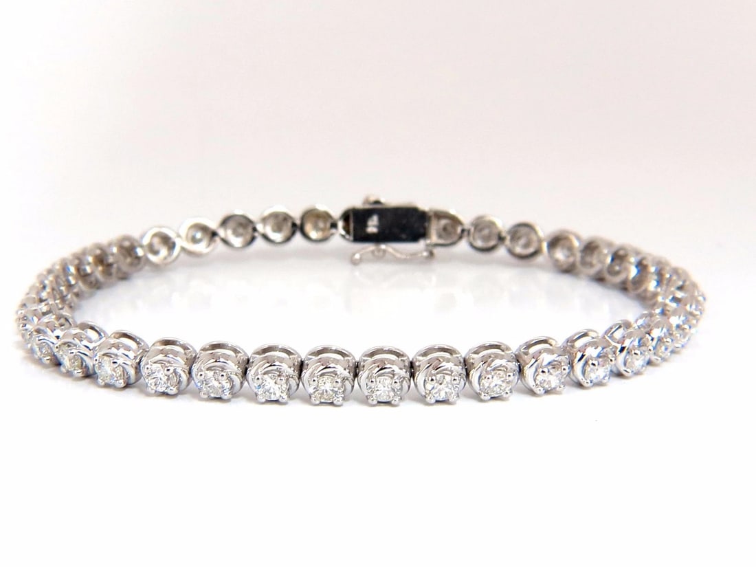3.50ct natural diamonds tennis bracelet 14kt 7 inch: Title: 3.50ct natural diamonds tennis bracelet 14kt 7 inch Description: Classic straight line Tennis 3.50ct. Natural diamonds bracelet. Round, full cuts G color Vs-2 clarity. 14kt. white gold 14.3 Gra