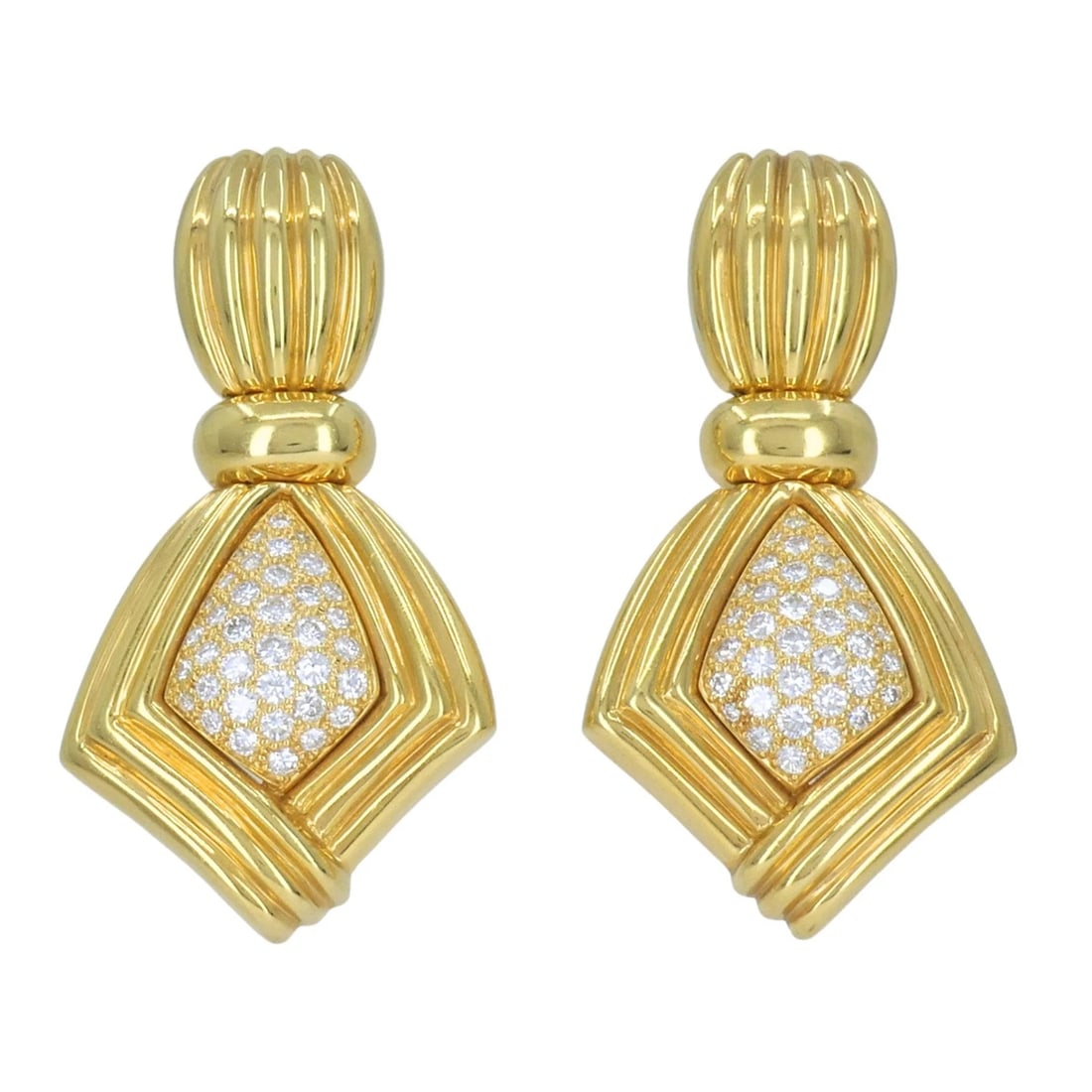 Vintage Boucheron Paris 18k Gold Diamond Ribbed Drop Earrings: KL JJOOO Boucheron Paris 18k yellow gold and diamond clip earrings, circa 1980s, designed with a bold ribbed gold form and pavé diamond centers. Each earring features a fluted oval top above a ge