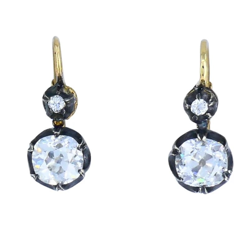 Victorian 14k Gold Silver Two-Stone Diamond EARRINGS Old Mine Cut Antique: VK JOTOO Victorian Diamond Silver 14 karat Yellow Gold Earrings This pair of Victorian two-stone diamond earrings is crafted in 14k yellow gold with silver settings. Each earring is designed with a sm