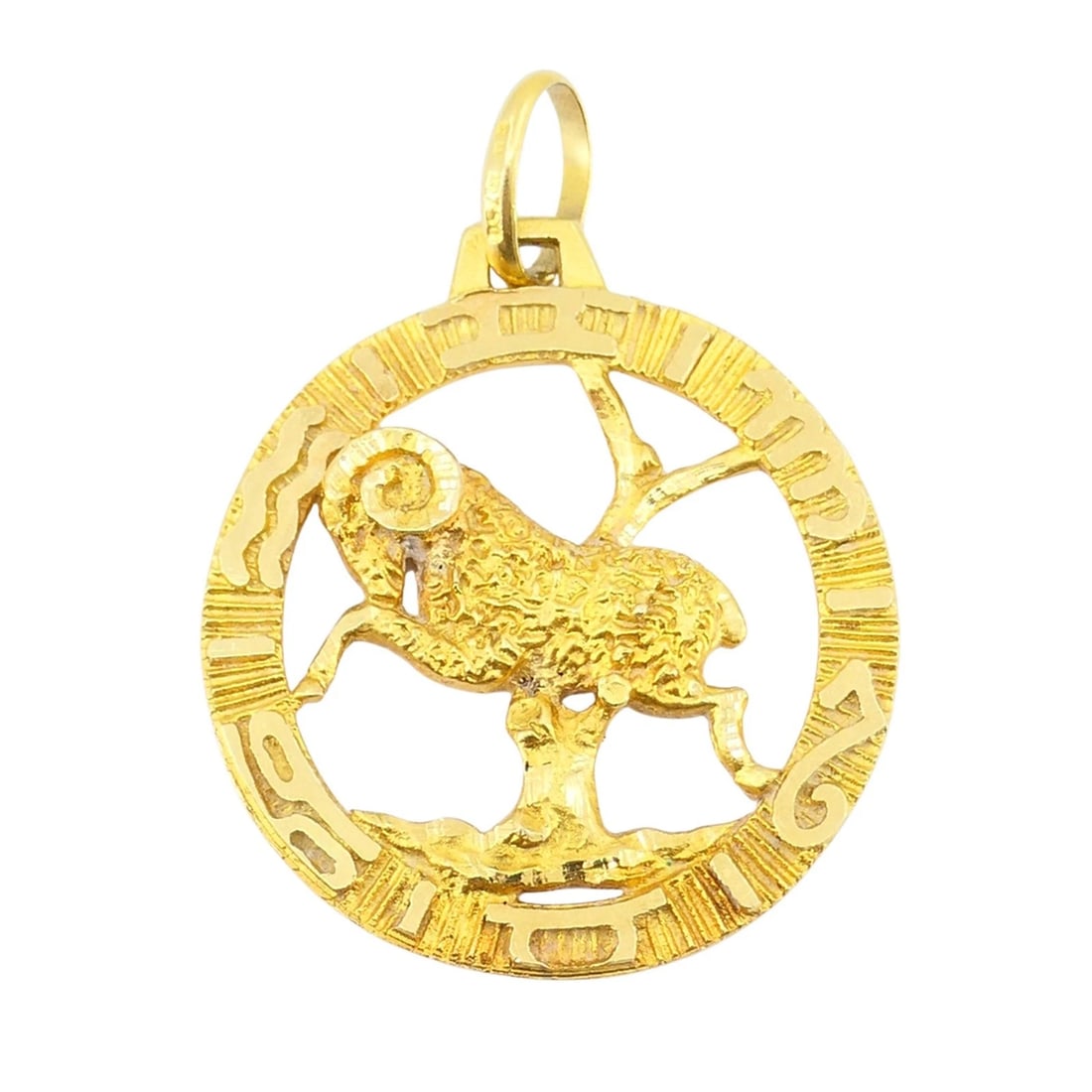 Vintage 18k Gold Aries Astrological Zodiac Pendant: ES JOOO An Aries pendant, crafted in 18K yellow gold. The pendant is open-work and features a finely detailed ram, the traditional symbol of Aries, framed within a textured circular border. The intric