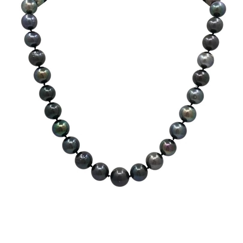 Tahitian Pearl Strand Necklace 14k Gold Clasp: ES ITOO Product details: MATERIALS: 14k Gold GEMSTONE: Pearl WEIGHT: 93 Grams MEASUREMENTS: 18" Beads Diameter - 1/2" to 7/16 HALLMARKS: 585, 14K ITEM DETAILS: Tahitian Pearl Strand Necklace 14k Go