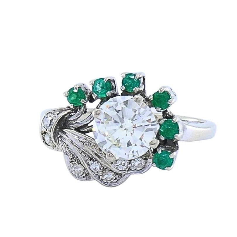 Vintage 14k White Gold Diamond Emerald Cocktail Ring: ES AJOO Product details: MATERIALS: 14k Gold GEMSTONE: Emerald , Diamond WEIGHT: 3.7 Grams MEASUREMENTS: 1/2" x 11/16" RING SIZE: 7.25 HALLMARKS: 14K ITEM DETAILS: Vintage 14k White Gold Diamond