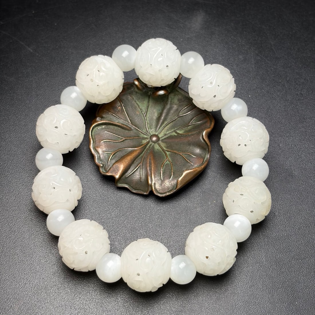 Openwork Hetian Jade Beads Bracelet: Title: Old Hetian Jade Dragon Pendant Date/Period: After2111 Origin: Chinese Dimension: 59x80x25(mm) 2.32x3.15x0.98(inches) Weight 0.35 lbs/157g Materials: Hetian Jade Reserve: $199.00 Shipping: