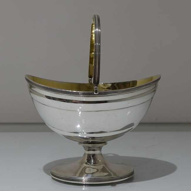 18th Century Antique George III Sterling Silver Sugar Basket London 1797 John Emes: Title:18th Century Antique George III Sterling Silver Sugar Basket London 1797 John EmesDescription:Description A stylish swing handled oval sugar basket decorated with applied upper and lower reed bo
