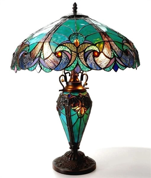 24.5" Stained Glass Lighted Base Table Lamp: 24.5" Height 18" Width These captivating reproduction stained glass pieces are crafted using the exact technique pioneered by the renowned artist Louis Comfort Tiffany in the early 1900s. Every