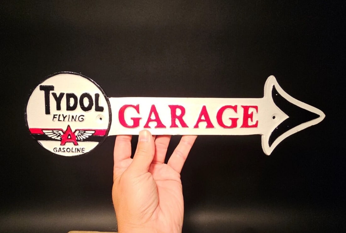 Cast Iron Tydol Flying Gas Oil Garage Sign Plaque: 16 1/2" Long x 5" High Such a neat reproduction cast iron plaque/sign. This sign is all solid cast iron. Hand painted, wonderful signs of wear and distress. Hard to tell its age! Reserve: $25.00 Shipp