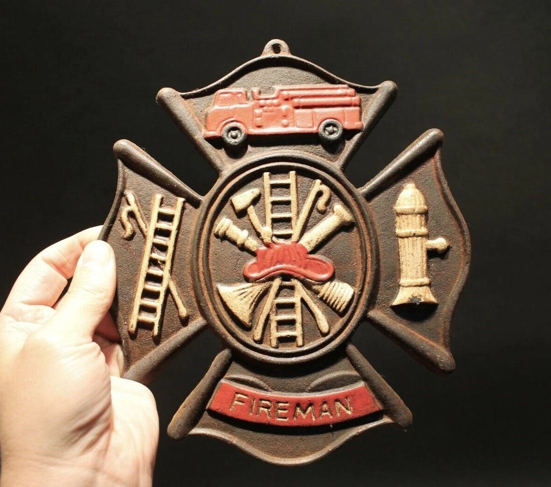 Cast Iron Fire Fighter Plaque Fire Mark Sign: 9" Tall x 7 3/4" Wide Well made reproduction cast iron Fire Fighter Fireman plaque. Be sure to see the pictures.. looks old but is actually fairly new.. Reserve: $25.00 Shipping: Domestic: Flat-rate o