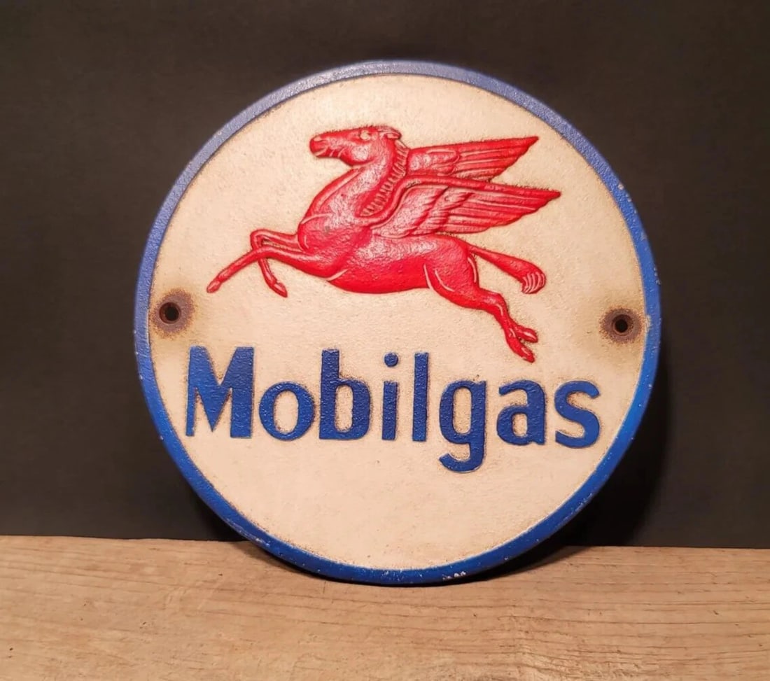 Cast Iron Round Mobile Gas Oil Sign Plaque: 9 1/4" round 1/4" thick Such a neat reproduction cast iron plaque/sign. This sign is all solid cast iron. Hand painted, wonderful signs of wear and distress. Hard to tell its age! Reserve: $50.00 Ship