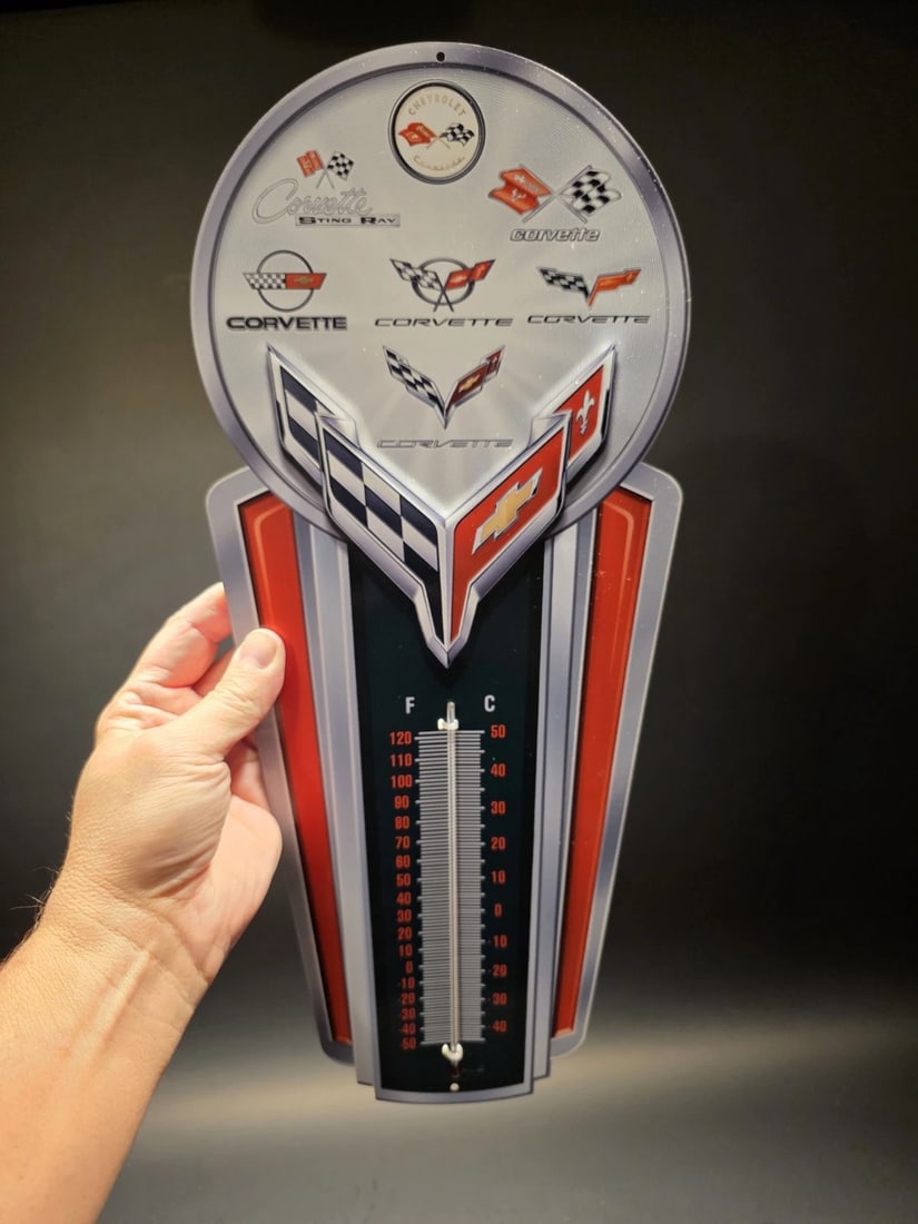 Metal Corvette Generations Wall Thermometer Garage Sign: 17.5 Vintage-Style Corvette Generations Wall Thermometer - Garage Decor Celebrate the legacy of an American icon with this vibrant wall thermometer. Featuring the evolution of Corvette logos through