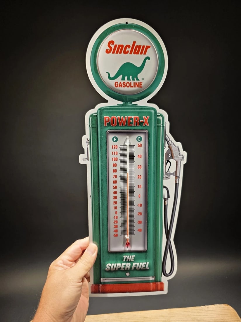 17 1/2 " Metal Sinclair Oil Advertising Thermometer Sign: 17.5" This classic reproduction Sinclair pump thermometer is a must-have for any garage or man cave. Crafted from durable 24 gauge steel and printed with UV-resistant inks, this thermometer is built