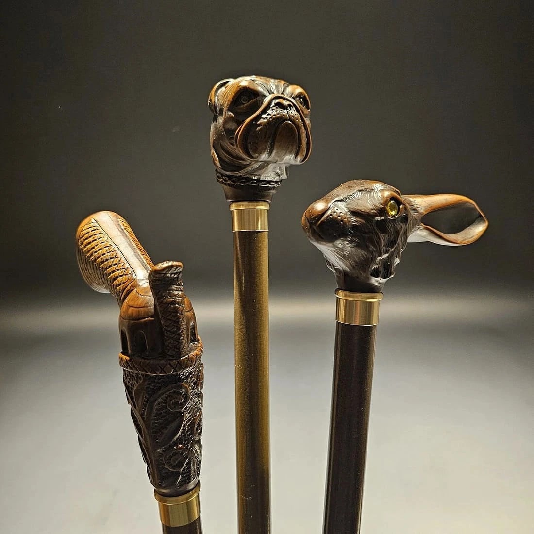 Lot of 3 Figural Walking Stick Canes: (3) 36" Long 3/4" shaft Wonderful lot of 3 figural walking canes, all made in Italy. Crafted from robust cellulose acetate, the handles all sits atop a 3/4" beechwood shaft with a walnut lacquer