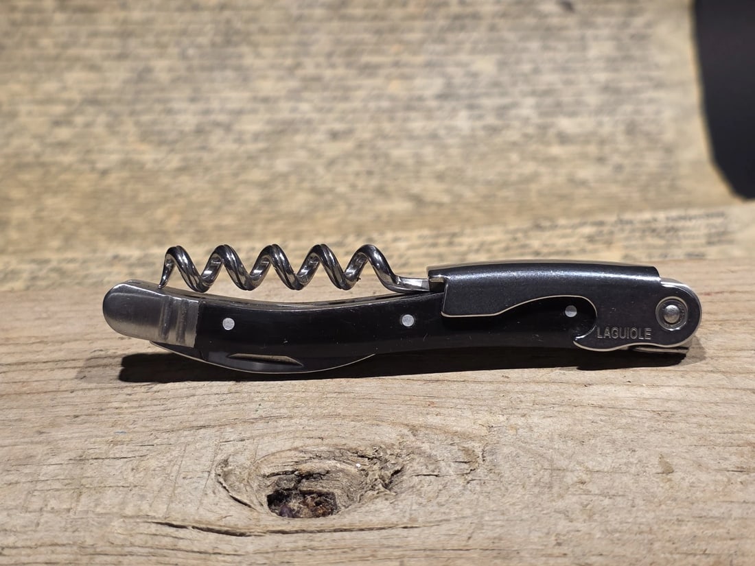Laguiole Corkscrew with Black Horn Handles: 4 1/2" long x 5/8" Wide Nice quality, brand new, never used heavy waiters style Laguiole corkscrew with bovine ox horn handles, stainless steel. The corkscrew features a ribbed worm for steady cork