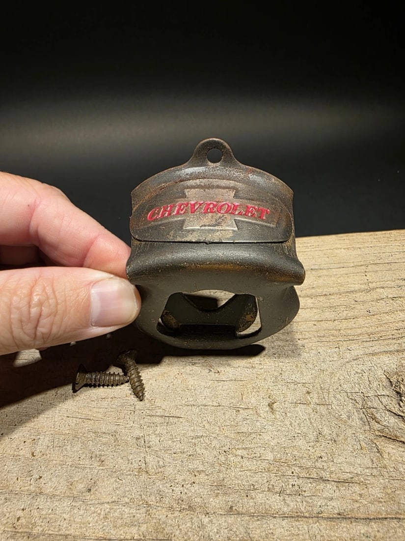 Chevy Beer Bottle Cap Opener: 3 1/4" tall x 2 3/8" wide Wonderful Chevrolet motors wall mount bottle cap opener. Well made all metal opener comes with mounting screws! Reserve: $15.00 Shipping: Domestic: Flat-rate of $8.00 to