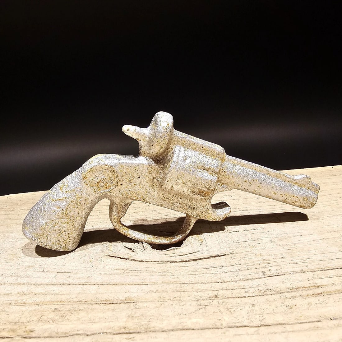 Cast Iron folk art Pistol Bottle Opener: 5 1/2" Great reproduction cast iron bottle opener. This piece was made to look just like an antique, but is new. Reserve: $5.00 Shipping: Domestic: Flat-rate of $5.00 to anywhere within the contiguous
