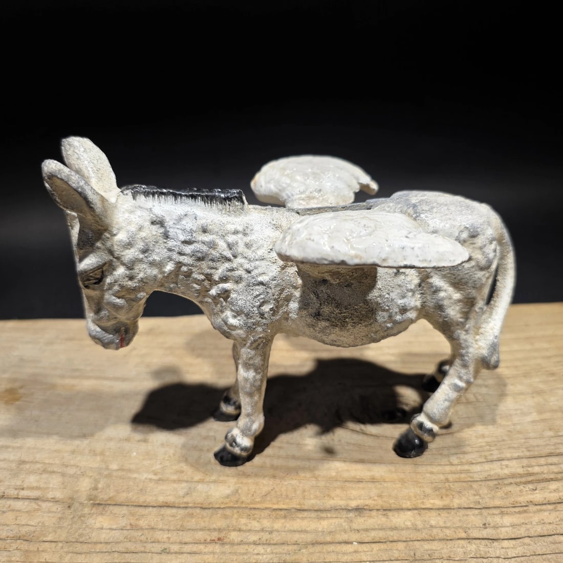 Cast Iron Flying Donkey Coin Bank: Reproduction Cast iron coin bank in the form of a winged donkey, a whimsical figural design rooted in early novelty bank themes. Animal-form banks were widely produced in the late 19th and early 20th 