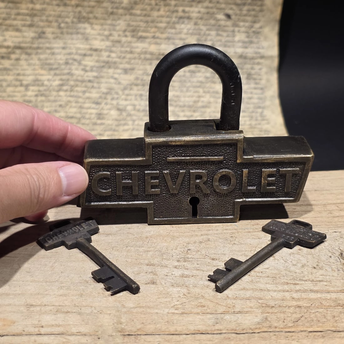 Brass & Iron Trunk Chest Box Chevrolet Lock Padlock: Reproduction functional padlock featuring the Chevrolet name in the classic bowtie form, styled after early automotive branding. Chevrolet, founded in 1911, became one of Americas most recognized auto
