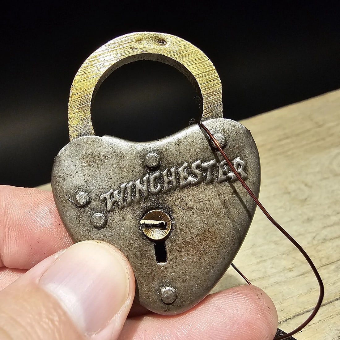 Brass Winchester Firearms Ammo Box Padlock Lock & Key: 2 1/4" x 1 1/2" Wide Nice reproduction breass and iron winchester padlock! This lock is fully functional! Hard to tell its age. sheet iron and brass. Great aged patina throughout. Limited quantity