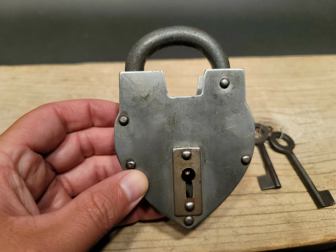 Cast Iron Steel Heart Bridge Padlock Lock & Key: 5" tall x 3 1/4" Wide Nice reproduction heart shaped cast iron and steel padlock! This lock is fully functional! Hard to tell its age. Heavy iron and brass. Great aged patina throughout. Limited