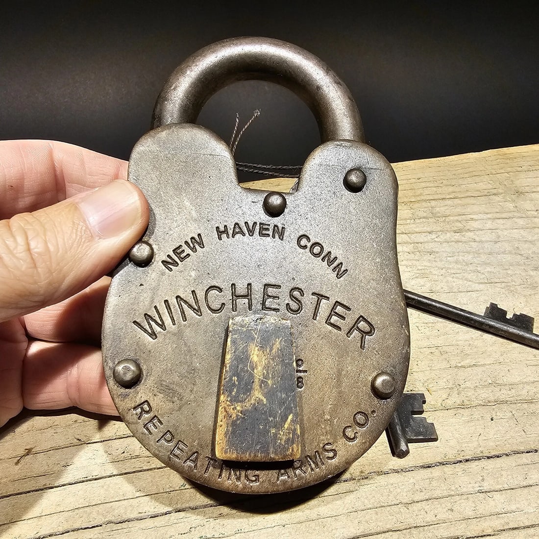 5" Cast Iron Winchester Firearms Ammo Box Padlock Lock: 3" Wide x 5" Tall Nice reproduction brass winchester padlock! This lock is fully functional! Hard to tell its age. Heavy iron and brass. Great aged patina throughout. Limited quantity available!